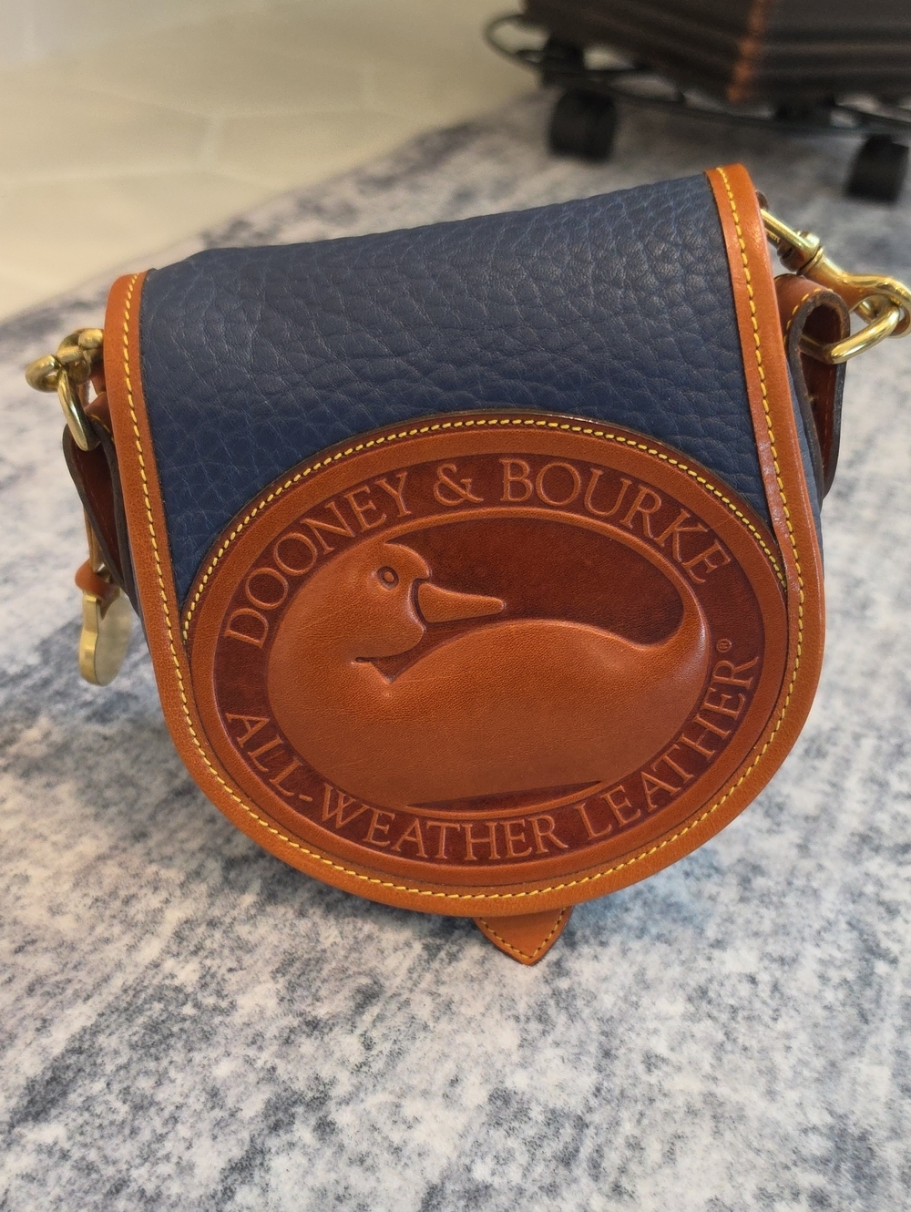 Dooney & Bourke Navy and Brown All-Weather Leather Crossbody